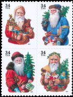 Scott 3537-3540; 3540a<br />34c Holiday Santas (Pane /DSB)<br />Large 2001 Date; Pane Block of 4 #3537-3540 (4 designs)<br /><span class=quot;smallerquot;>(reference or stock image)</span>